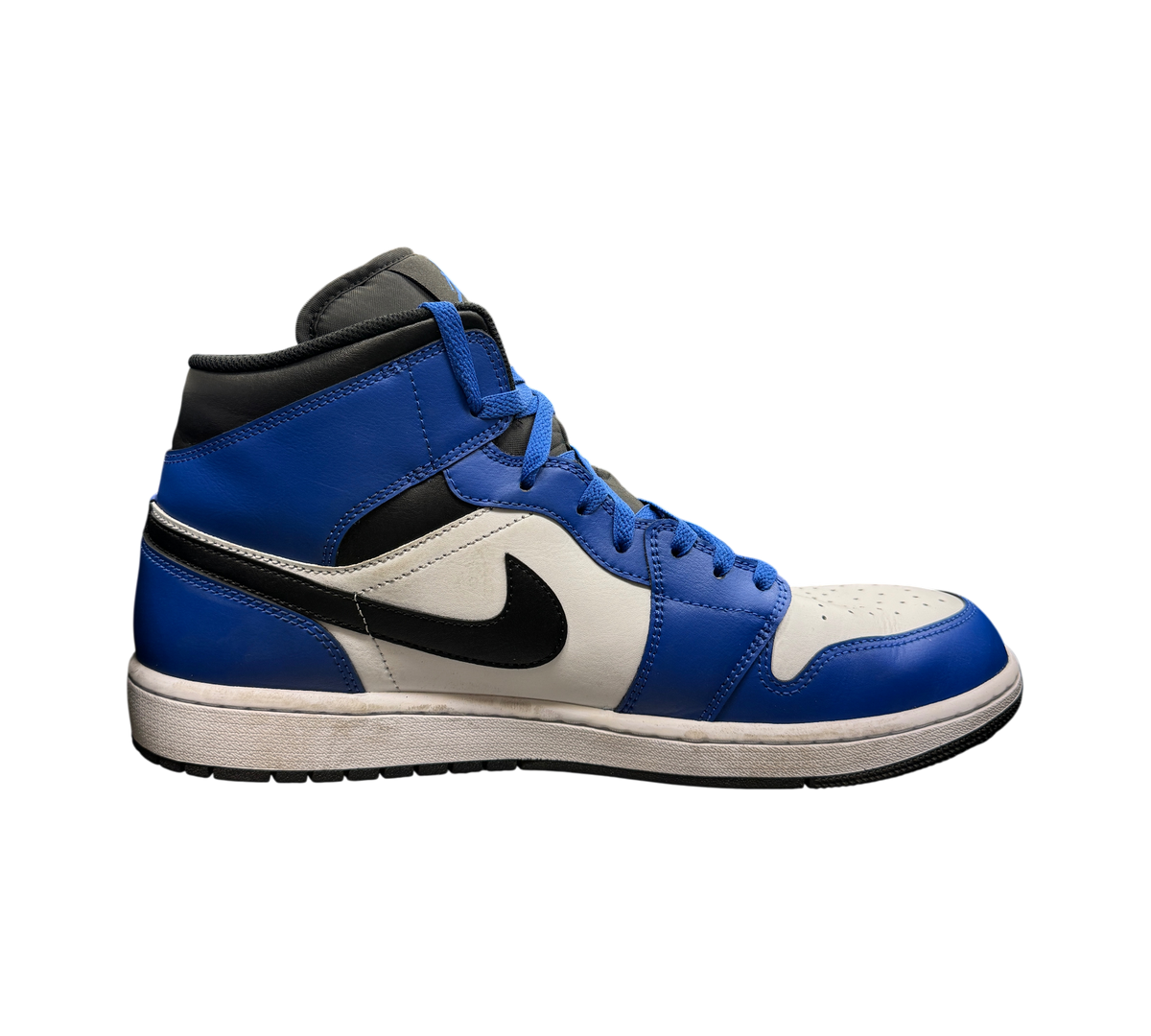 Genesis Boutique Jordan 1 Mid Game Royal sneakers in blue, white, and black leather, side profile view.