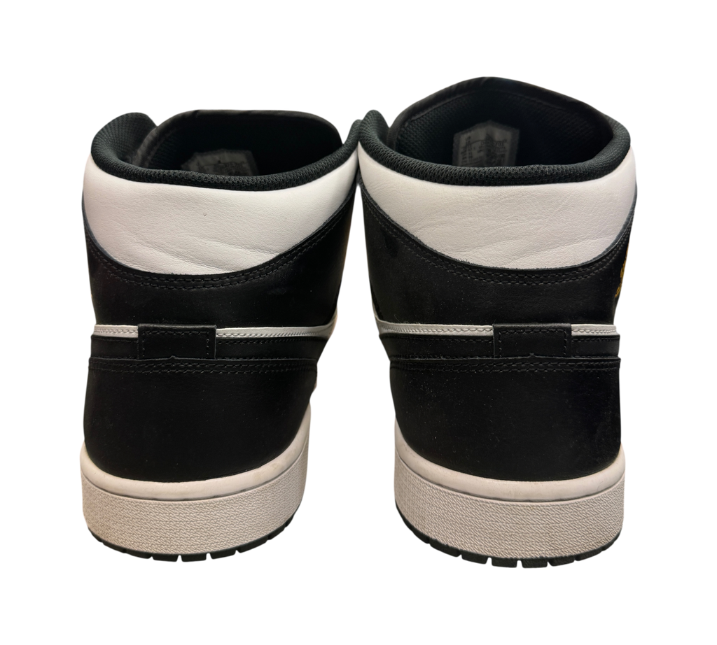 Genesis Boutique Jordan 1 Mid Yellow Ochre sneakers showing the black and white leather heel view