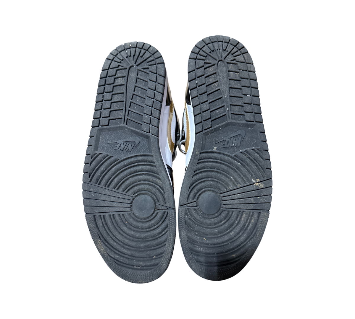Genesis Boutique used Jordan 1 Mid Metallic Gold sneakers showing black rubber outsoles with Nike branding