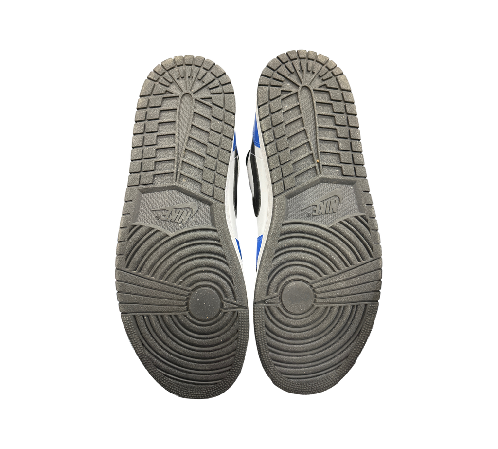 Genesis Boutique used Jordan 1 Mid Game Royal sneakers showing black rubber outsoles with circular traction patterns