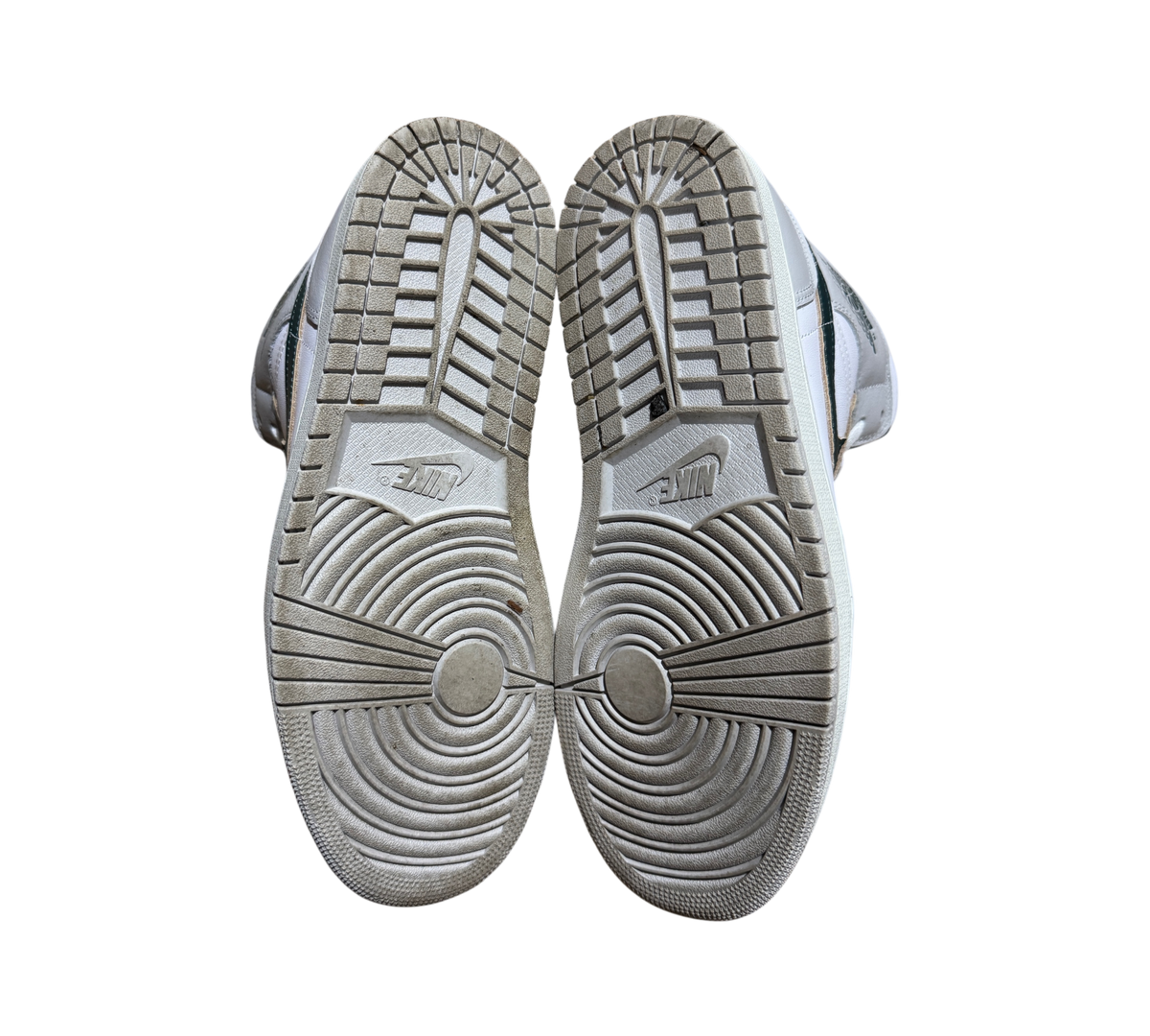 Genesis Boutique Jordan 1 Mid Oxidized Green sneakers showing the grey rubber outsoles with Nike branding