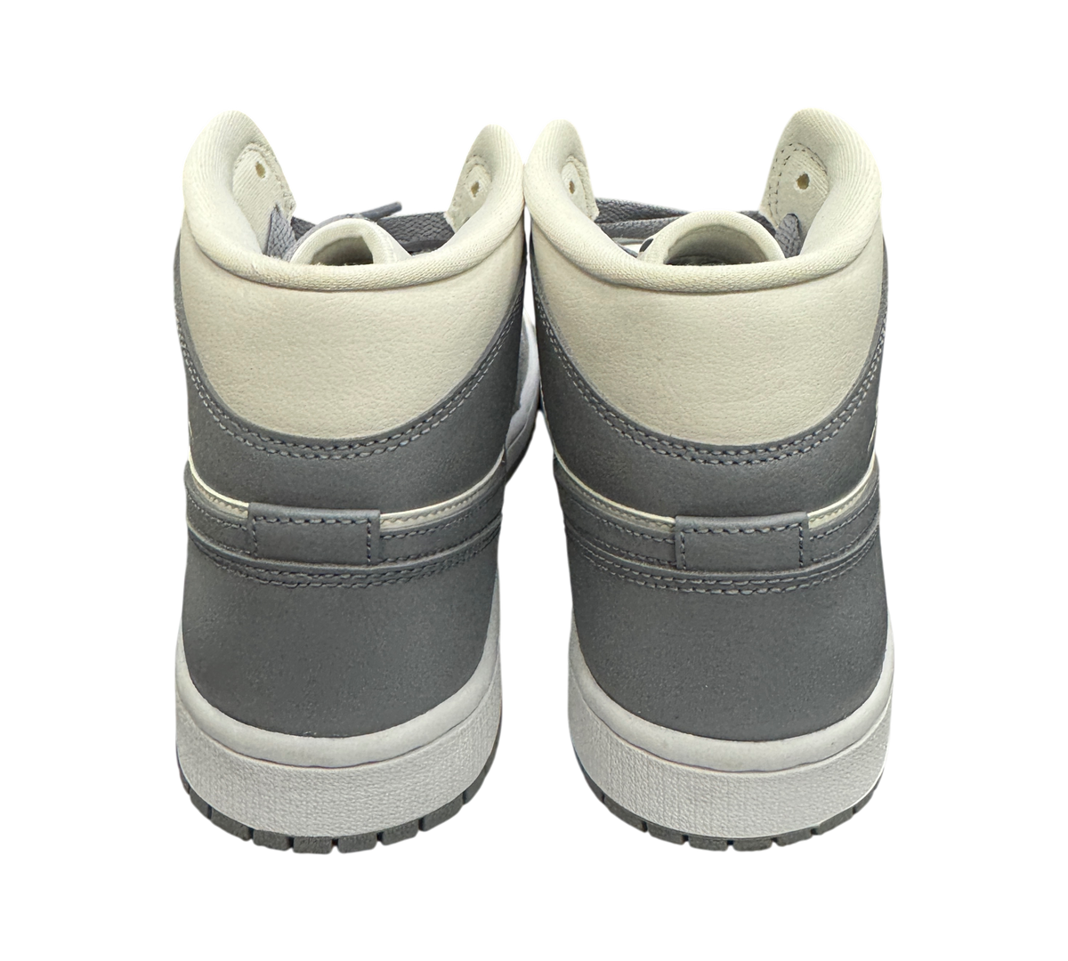 Genesis Boutique used Jordan 1 Mid Stealth sneakers, back view showing grey and white leather high-top design.