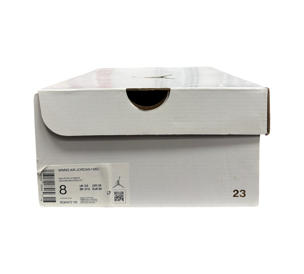 Genesis Boutique Jordan 1 Mid Stealth sneaker box with size label and branding in a retail store setting