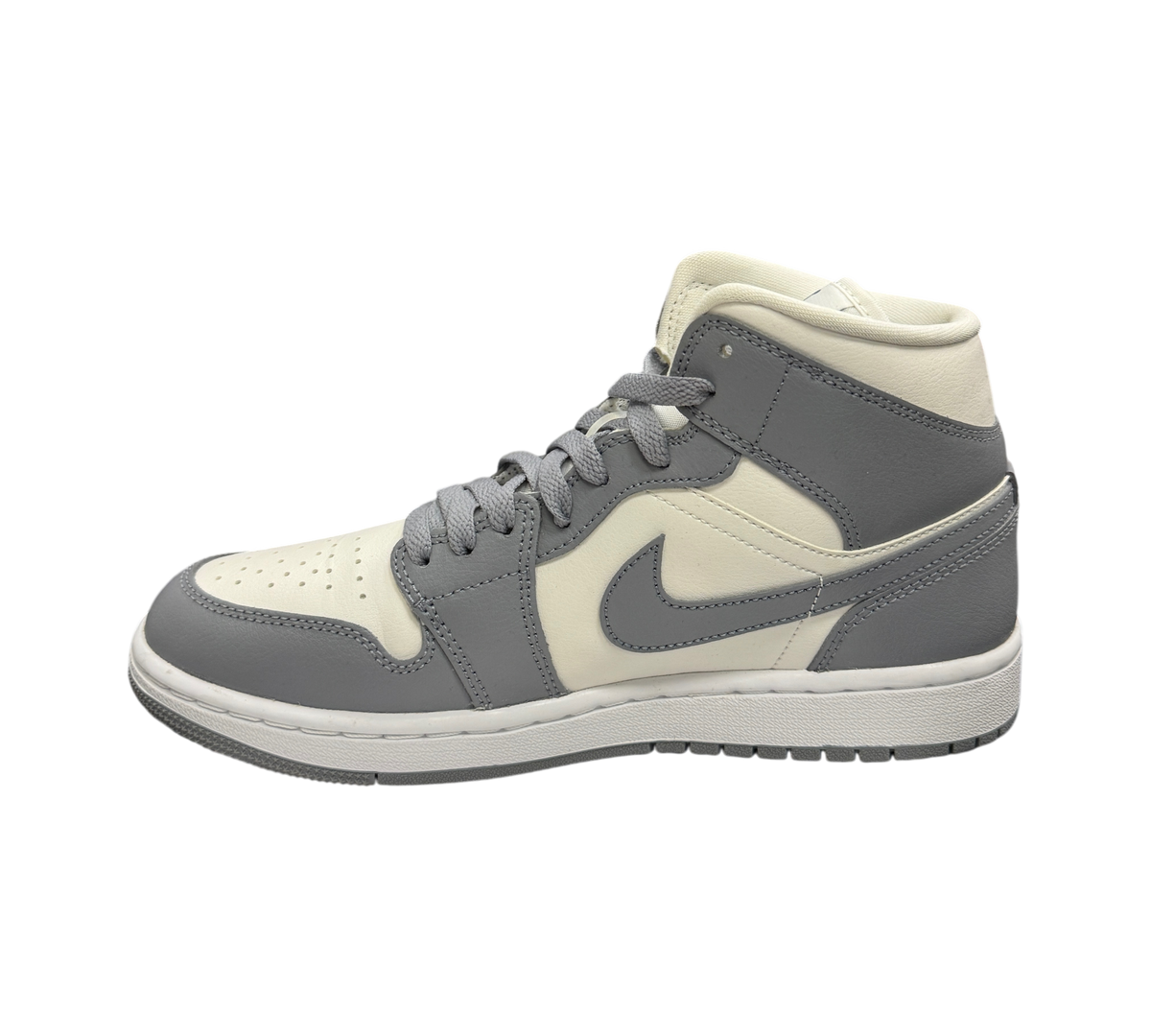 Genesis Boutique Jordan 1 Mid Stealth sneakers in grey and white leather, side profile view on a white box.