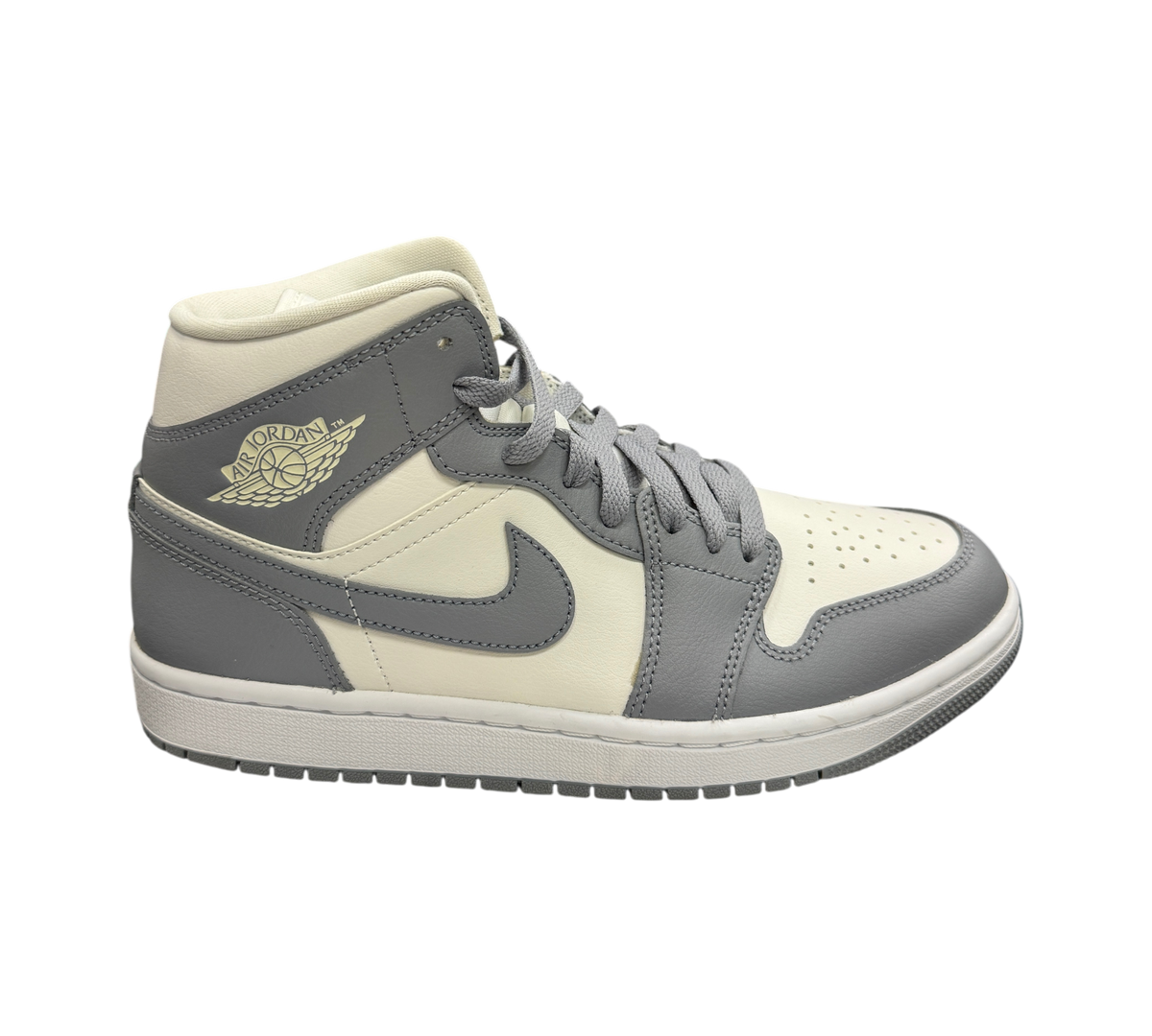 Genesis Boutique Jordan 1 Mid Stealth sneakers in grey and white leather with iconic wings logo on side profile