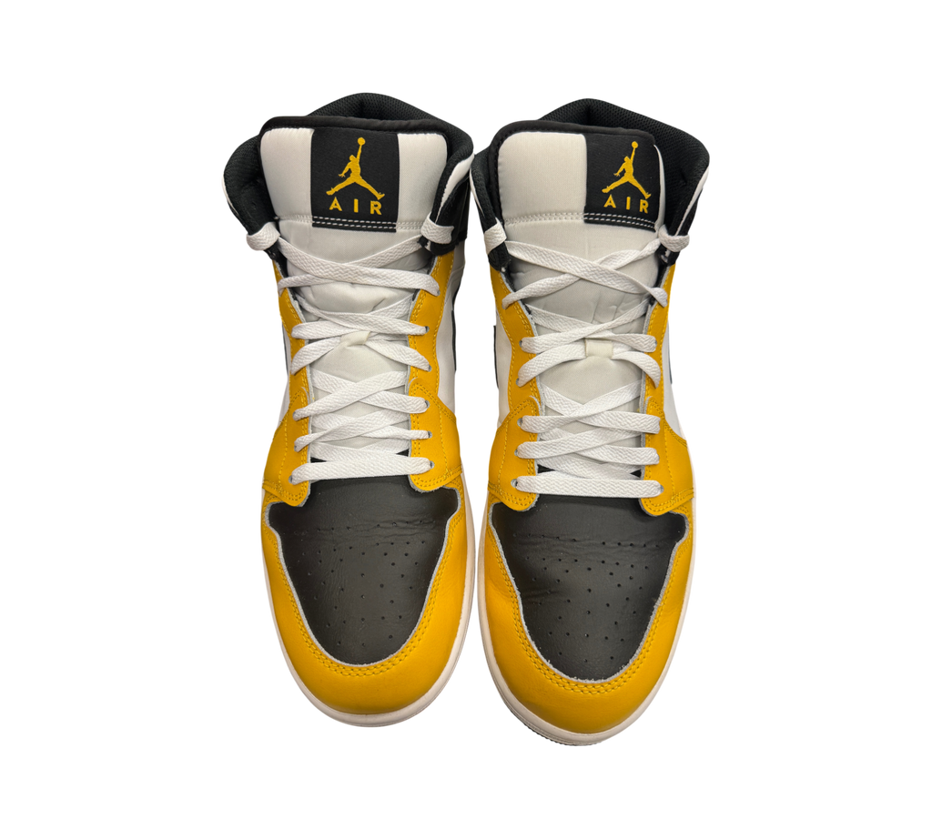 Genesis Boutique Jordan 1 Mid Yellow Ochre sneakers in black, white, and yellow leather with front view