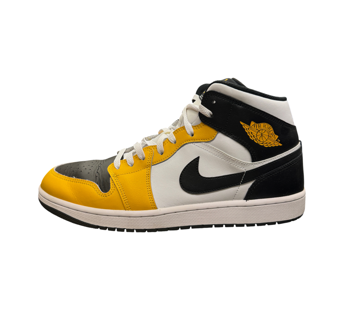 Genesis Boutique Jordan 1 Mid Yellow Ochre sneakers featuring black, white, and yellow leather panels