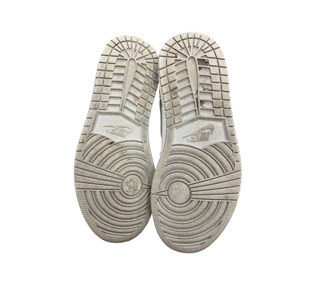 Genesis Boutique used Jordan 1 GS Hyper Royal sneaker outsoles showing tread wear and Nike branding