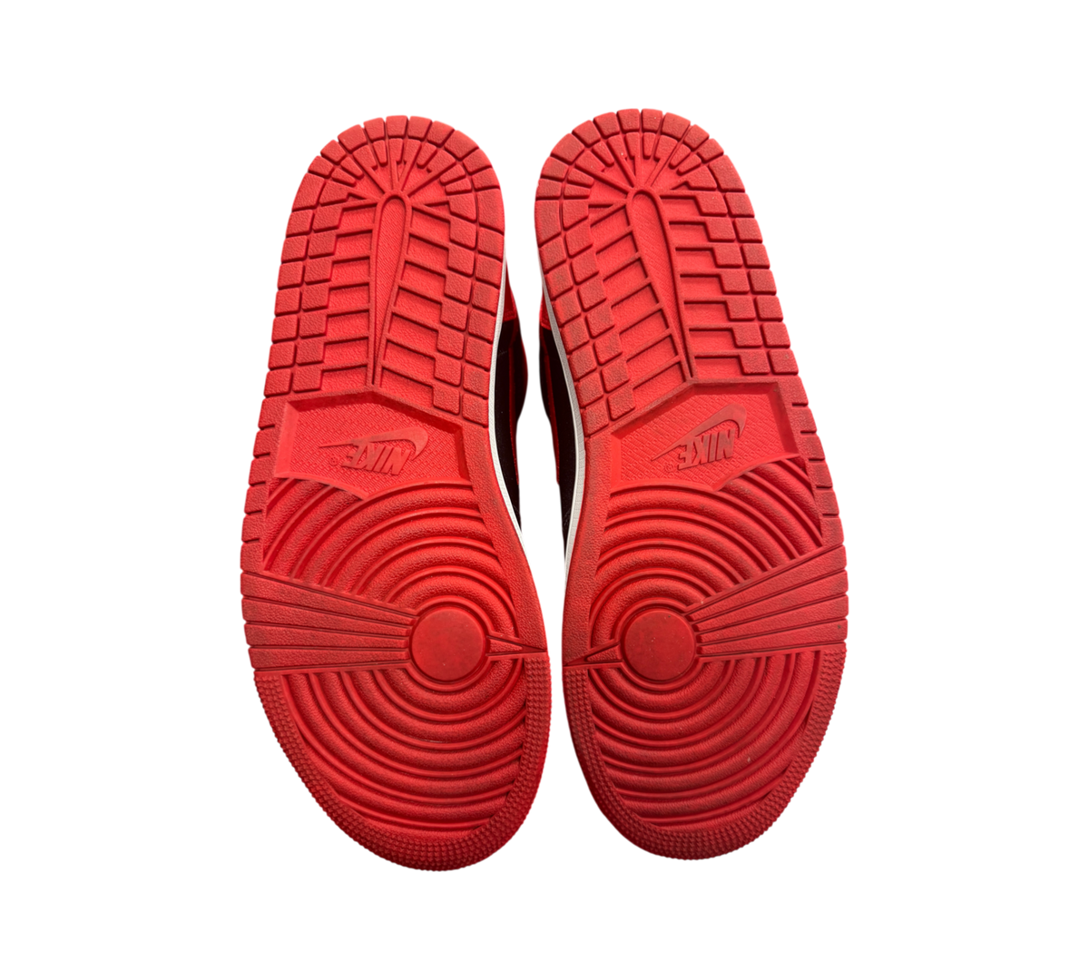 Genesis Boutique Jordan 1 High Satin Bred sneakers showing red rubber outsoles with classic Nike traction pattern
