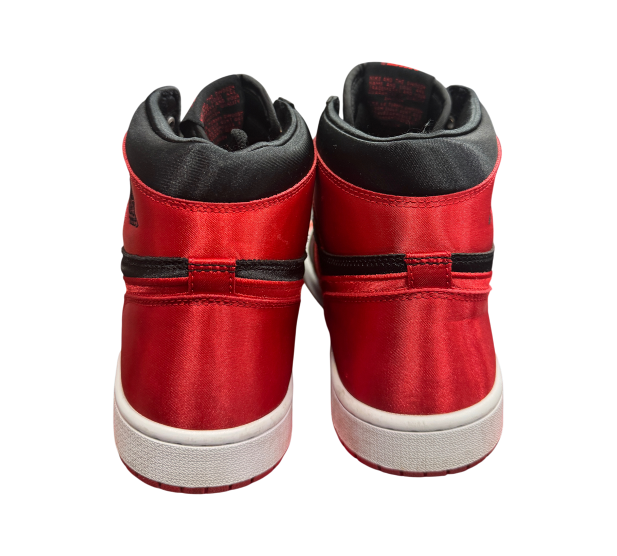 Genesis Boutique Jordan 1 High Satin Bred sneakers in red and black satin fabric, rear view showing high-top design.