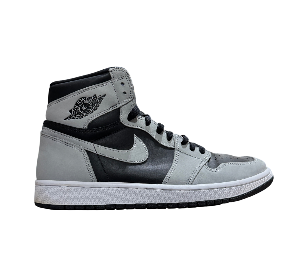Genesis Boutique Jordan 1 Shadow 2.0 sneakers in black and light grey leather, side profile view.