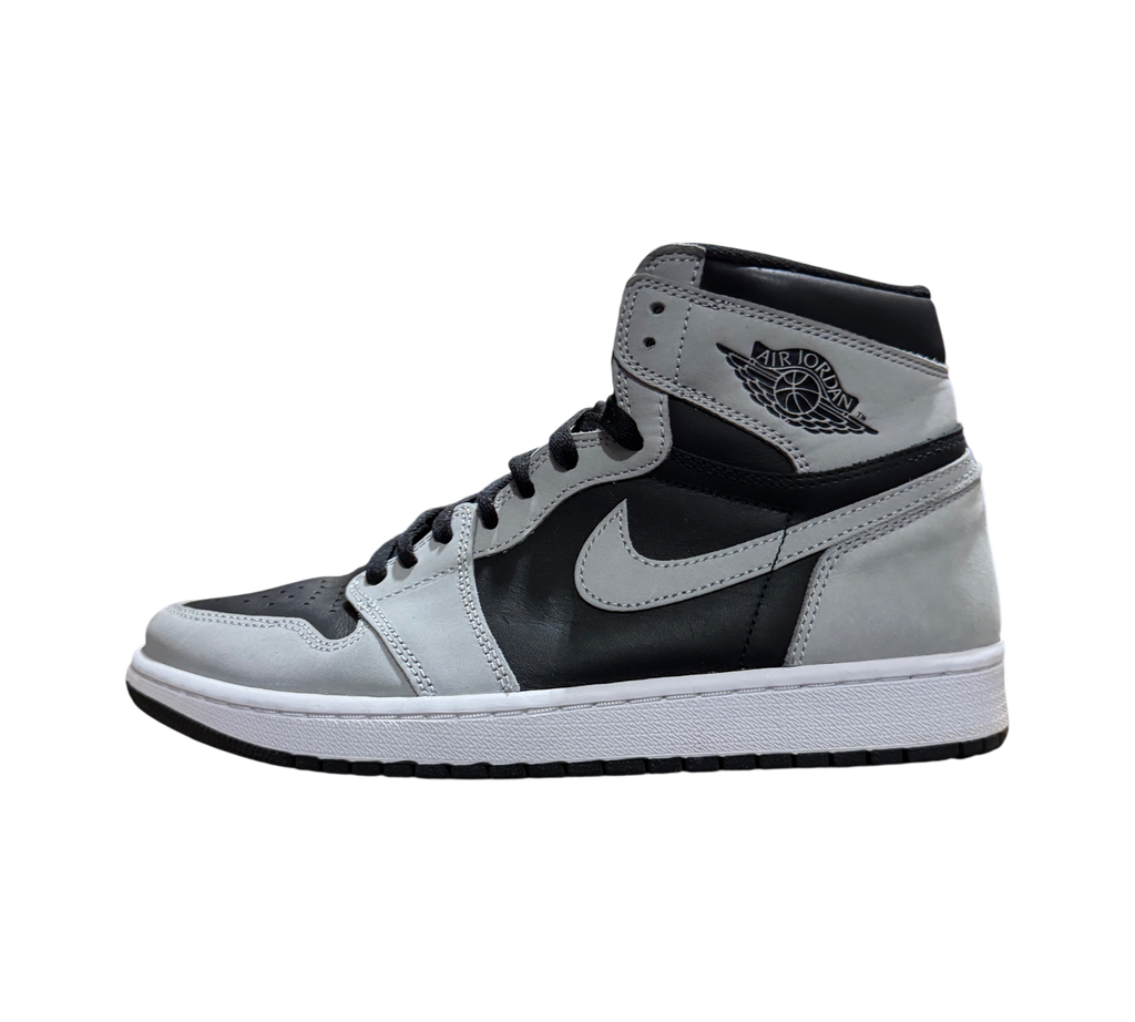 Genesis Boutique Jordan 1 Shadow 2.0 sneakers in black and light smoke grey leather, side profile view.
