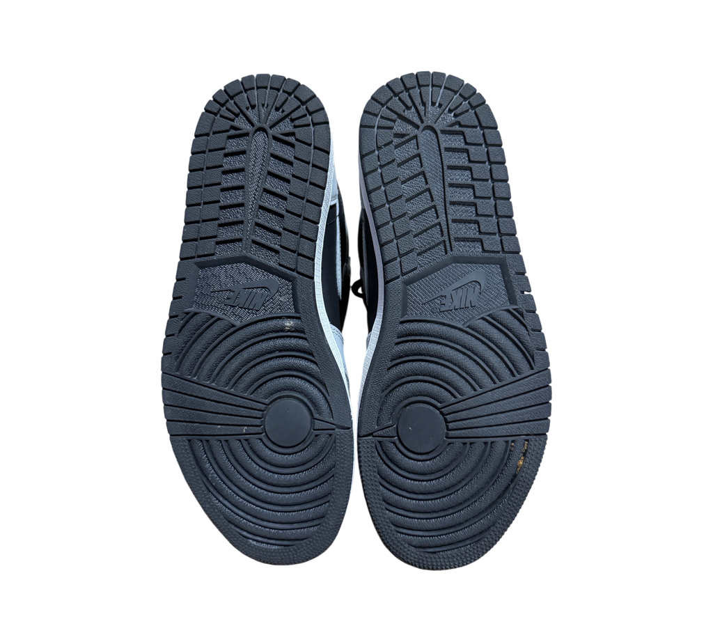Genesis Boutique Jordan 1 Shadow 2.0 sneakers showing black rubber outsoles with circular traction patterns