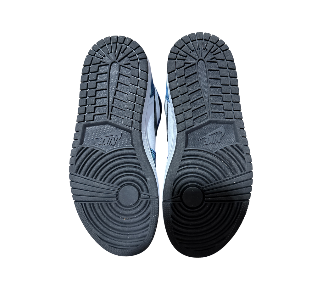 Genesis Boutique Jordan 1 Tie Dye sneakers showing clean black rubber outsoles with circular traction patterns
