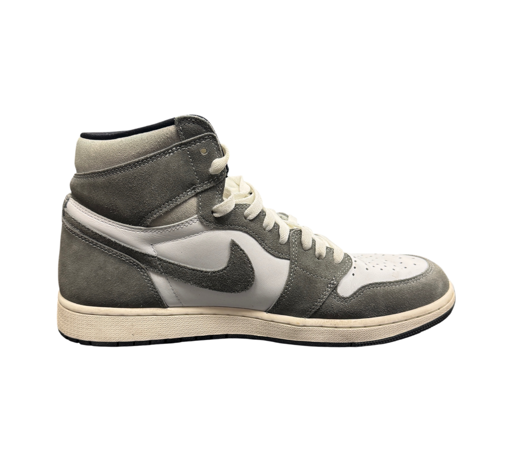 Genesis Boutique Jordan 1 Washed Black high-top sneakers in grey and white suede with off-white laces on a shoe box.