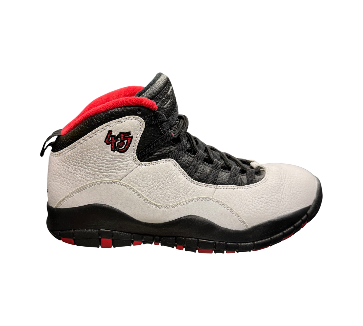 Genesis Boutique Jordan 10 Double Nickel sneakers in white, black, and red leather with 45 embroidery on the side.