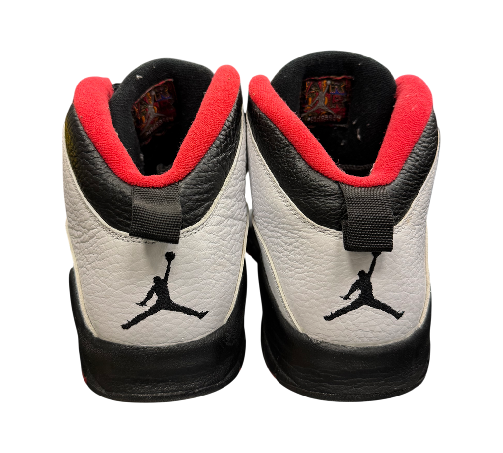Genesis Boutique Jordan 10 Double Nickel sneakers in white, black, and red leather with heel Jumpman logos.