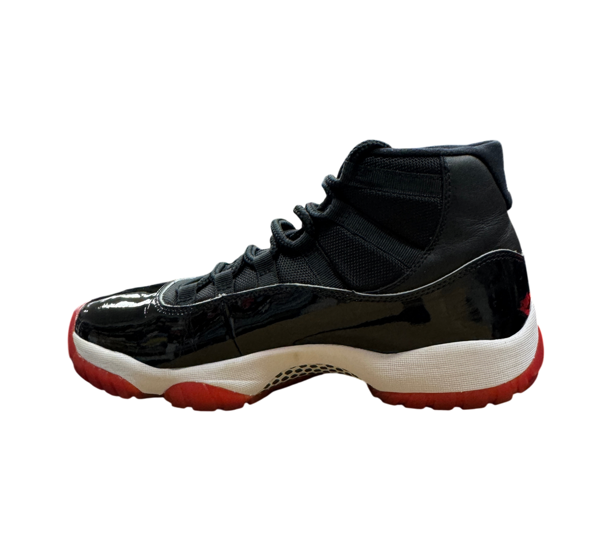 Genesis Boutique pre-owned Jordan 11 Bred 2019 sneakers featuring black patent leather and a red translucent outsole.