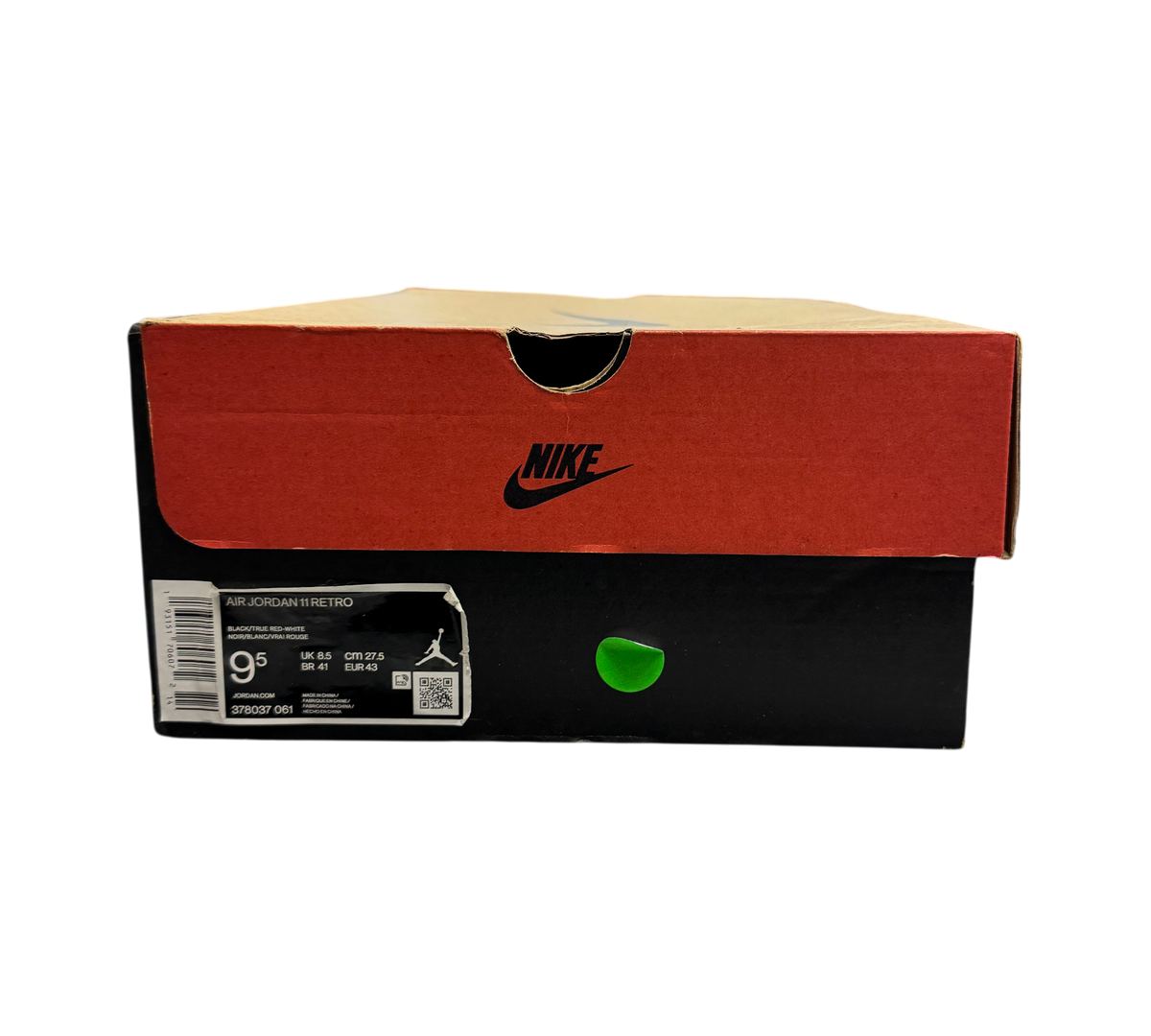 Genesis Boutique Jordan 11 Bred 2019 sneaker box with size 9.5 label and Nike branding in a retail store setting.