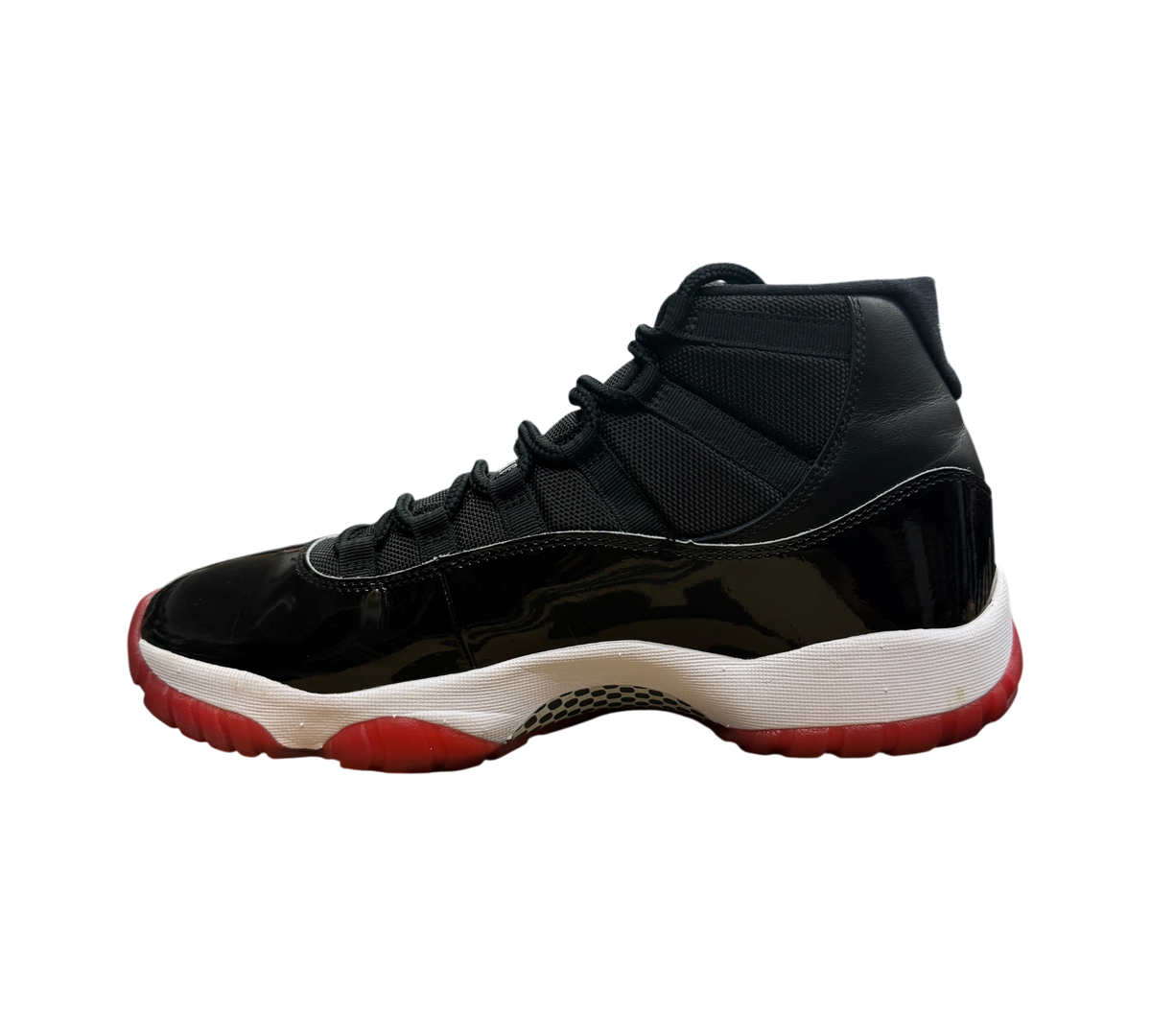 Genesis Boutique Jordan 11 Bred 2019 sneakers in black patent leather and mesh with a red outsole