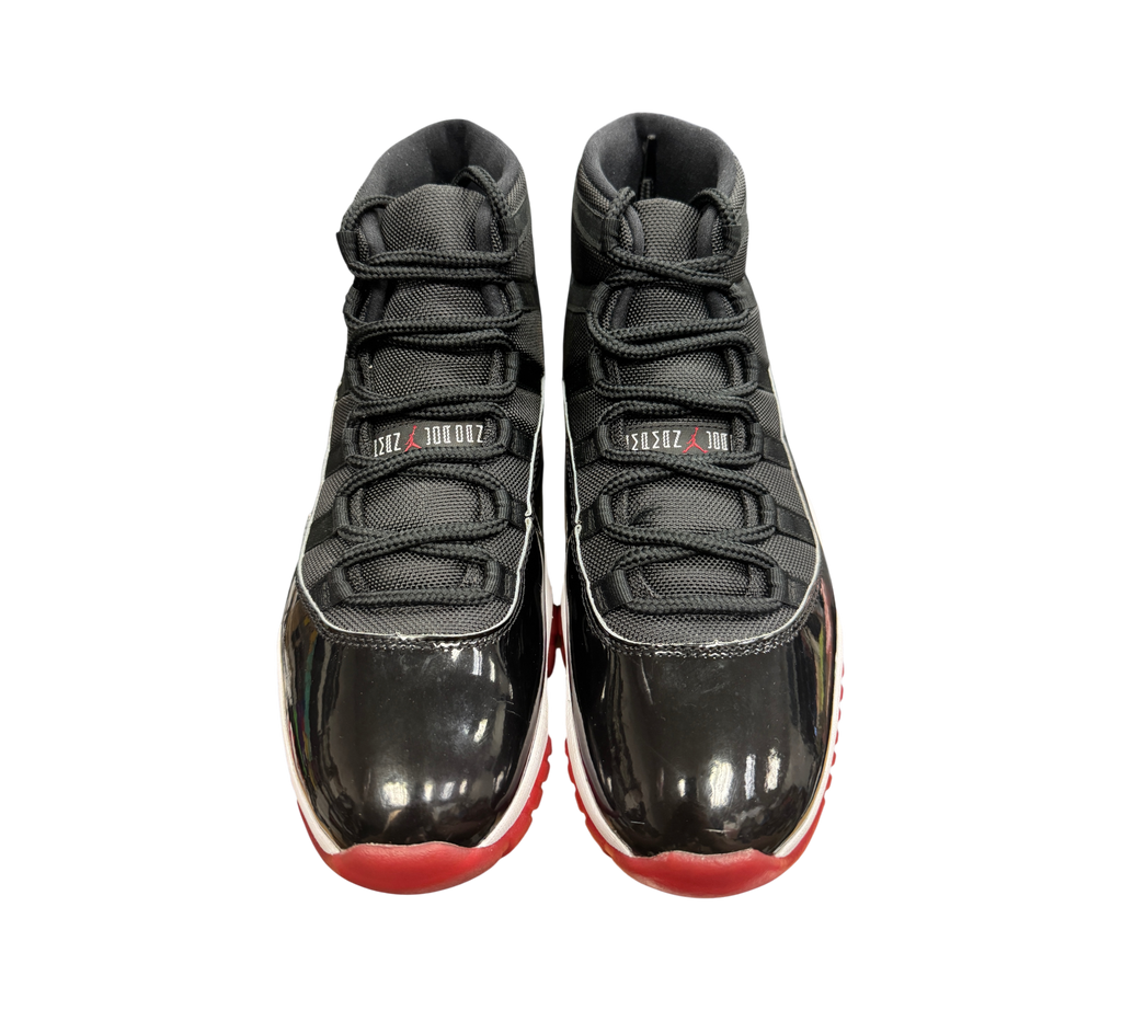 Genesis Boutique Jordan 11 Bred 2019 sneakers in black mesh and patent leather with red outsoles
