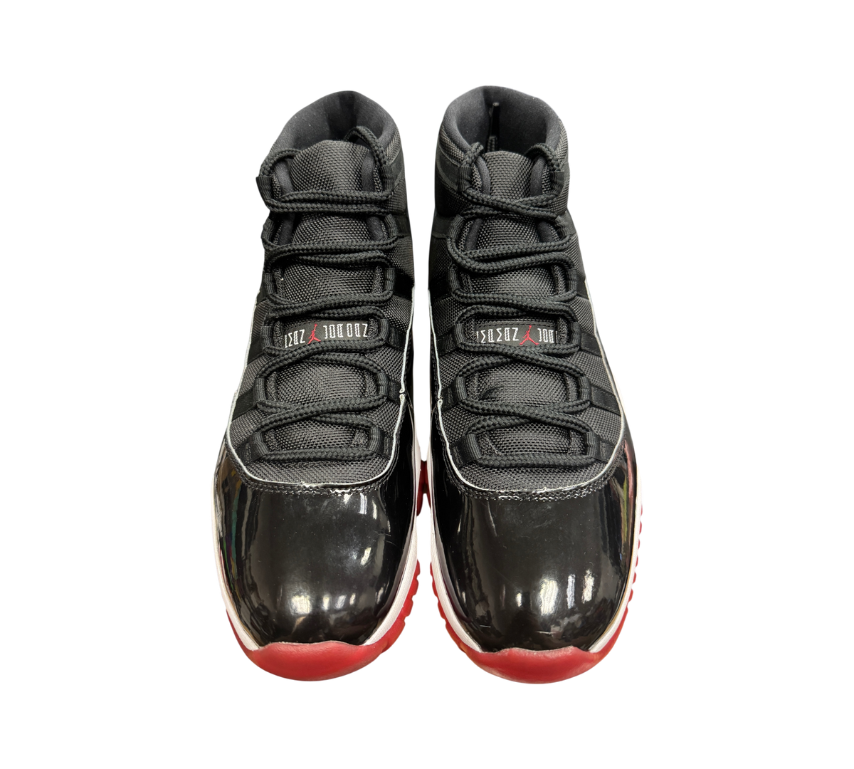 Genesis Boutique Jordan 11 Bred 2019 sneakers in black mesh and patent leather with red outsoles