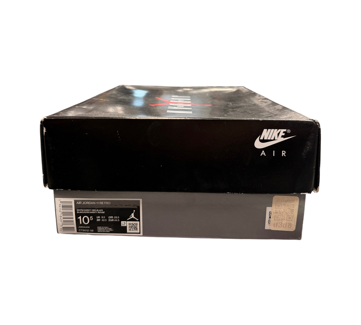 Genesis Boutique Jordan 11 Cherry sneaker box with Nike Air branding and size label in a retail store setting