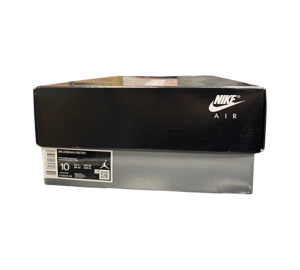 Genesis Boutique Jordan 11 Cherry sneaker box with Nike Air branding and size label in a retail store setting