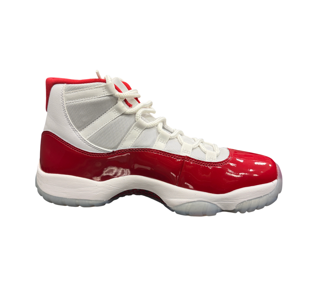 Genesis Boutique Jordan 11 Cherry sneaker with white mesh upper and glossy red patent leather mudguard