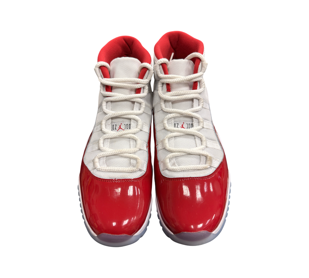 Genesis Boutique pre-owned Jordan 11 Cherry sneakers featuring white mesh uppers and glossy red patent leather mudguards