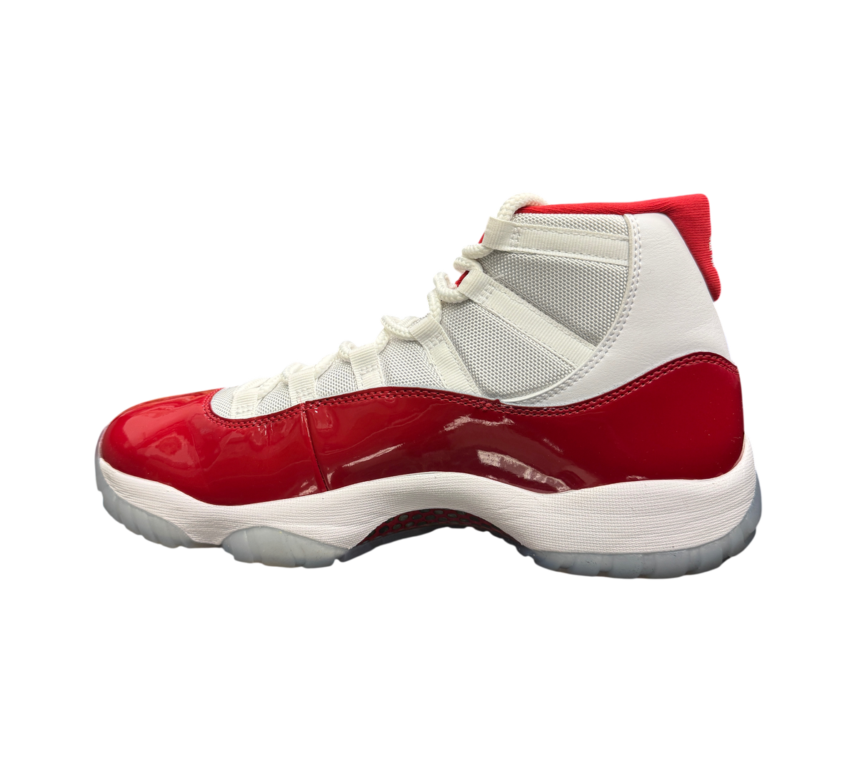 Genesis Boutique Jordan 11 Cherry sneakers featuring white mesh upper and glossy red patent leather mudguard