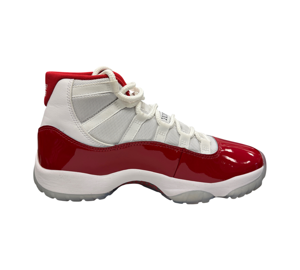 Genesis Boutique Jordan 11 Cherry sneakers in white and red with patent leather mudguard and white mesh upper