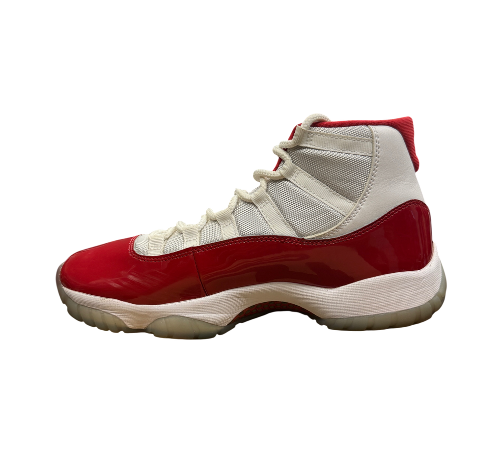 Genesis Boutique Jordan 11 Cherry sneakers featuring white mesh and red patent leather side profile view