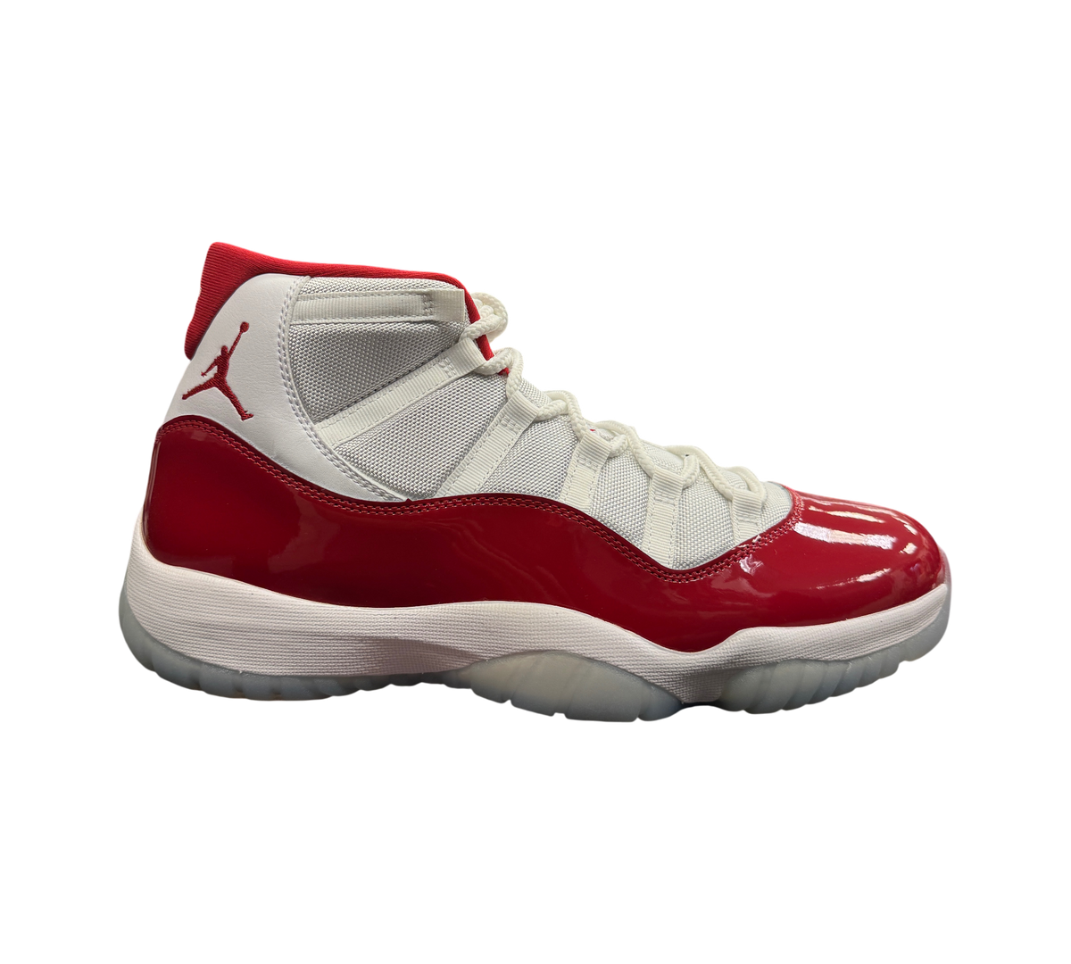 Genesis Boutique Jordan 11 Cherry sneakers featuring white mesh upper and glossy red patent leather mudguard