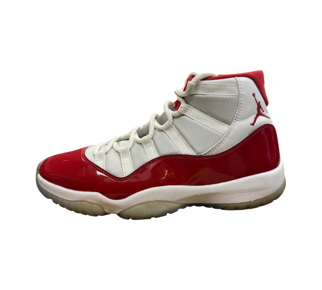 Genesis Boutique Jordan 11 Cherry sneakers in white and red patent leather with a translucent sole