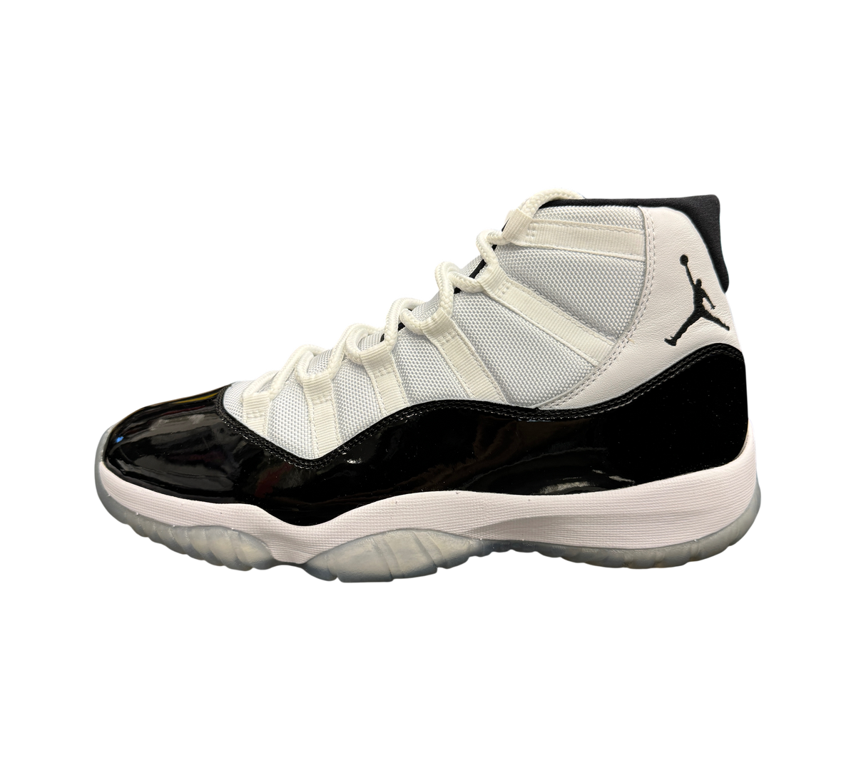 Genesis Boutique used Jordan 11 Concord sneakers featuring white mesh upper, black patent leather, and Jumpman logo.