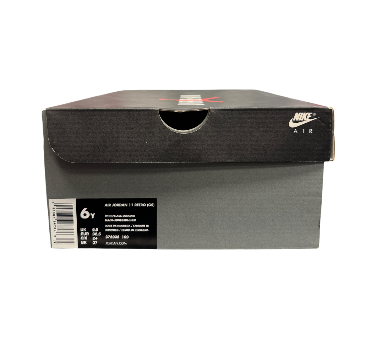 Genesis Boutique Jordan 11 GS Concord sneaker box with size label showing 6Y, displayed on a retail store shelf.