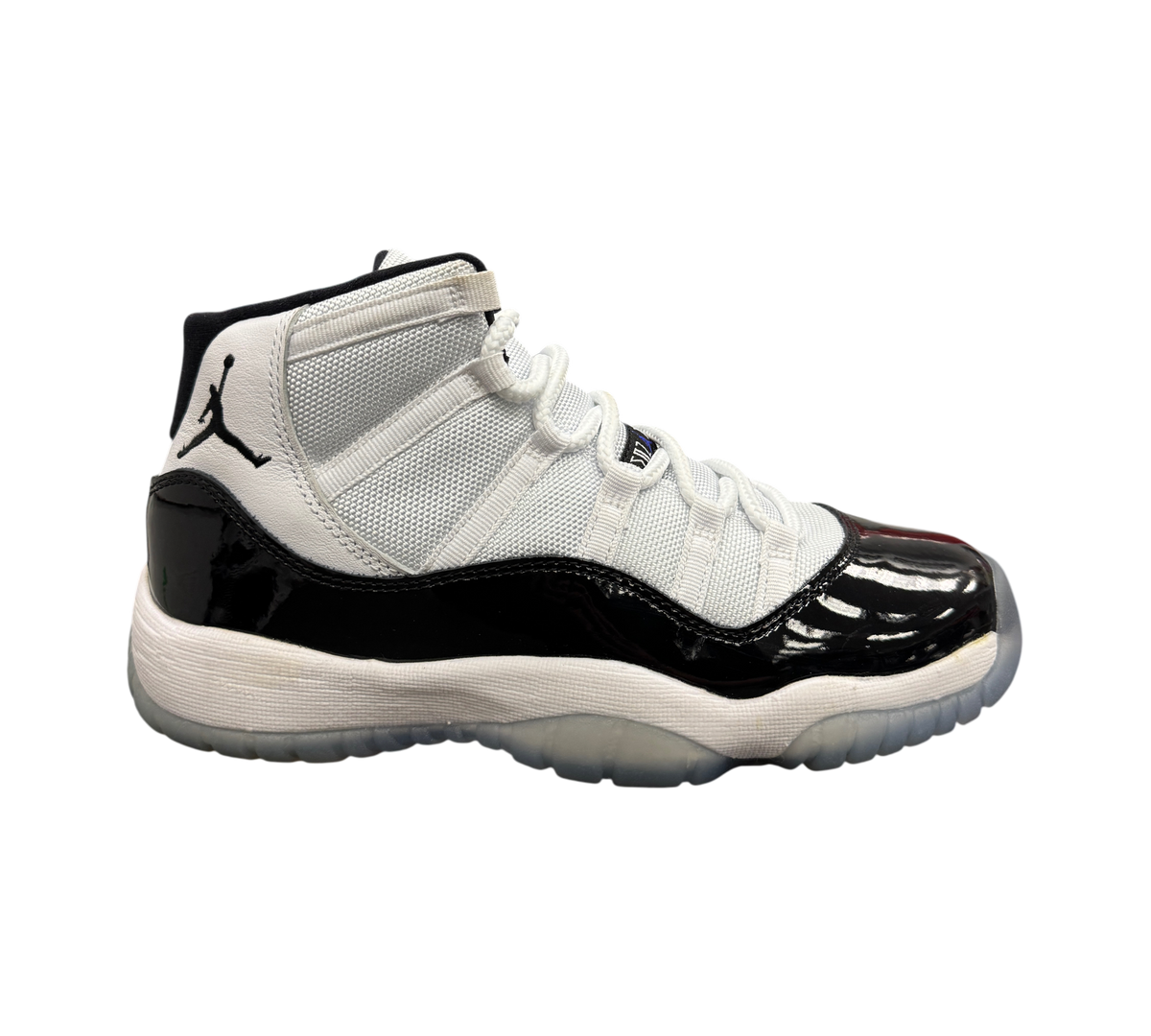 Genesis Boutique Jordan 11 GS Concord sneaker in white and black patent leather with a translucent sole