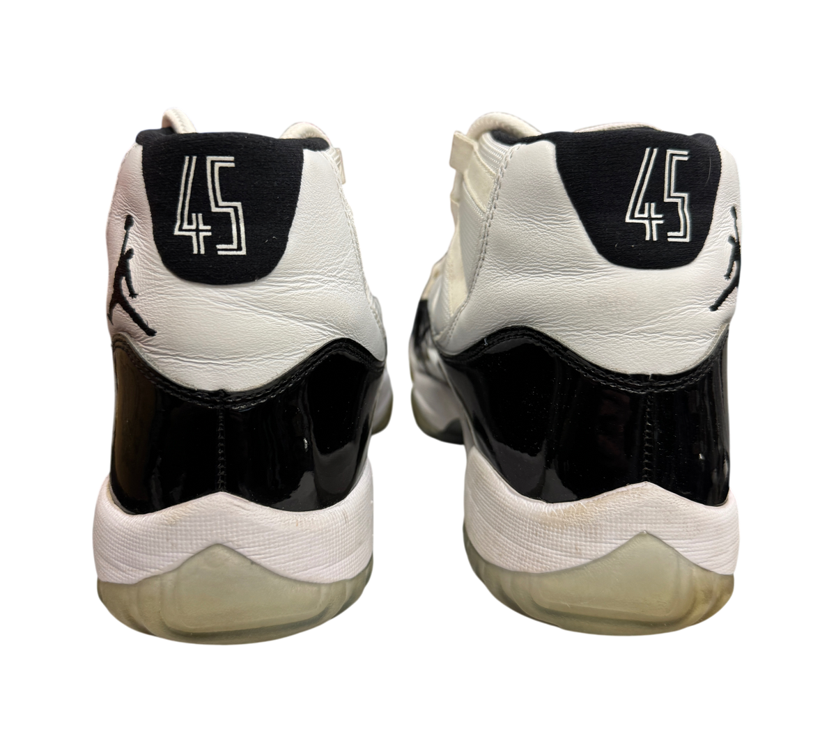 Genesis Boutique used Jordan 11 Concord sneakers showing the back heel with number 45 and black patent leather detail