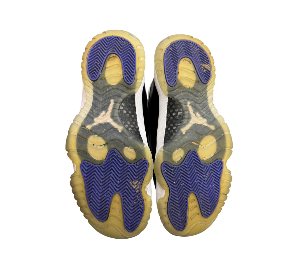 Genesis Boutique used Jordan 11 Concord sneakers showing purple and yellowed translucent rubber outsoles