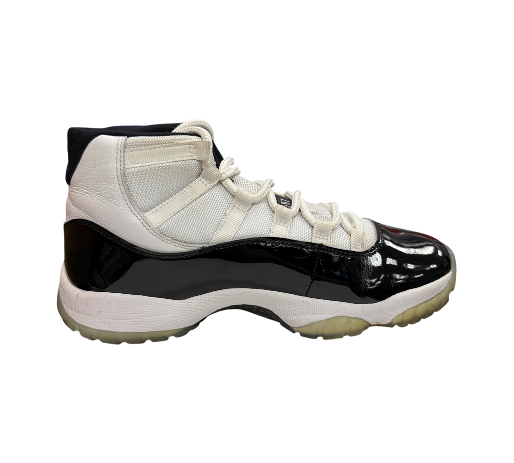 Genesis Boutique Jordan 11 Concord sneaker in white and black patent leather with a translucent outsole