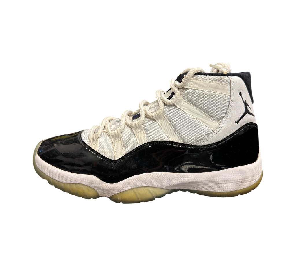 Genesis Boutique used Jordan 11 Concord sneakers featuring white mesh upper, black patent leather mudguard, and icy sole