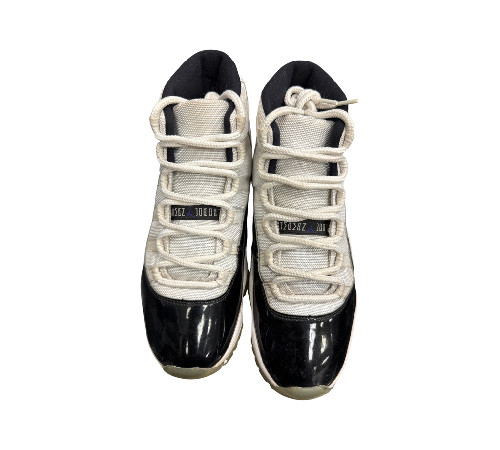 Genesis Boutique Jordan 11 Concord sneakers featuring white mesh uppers and black patent leather mudguards