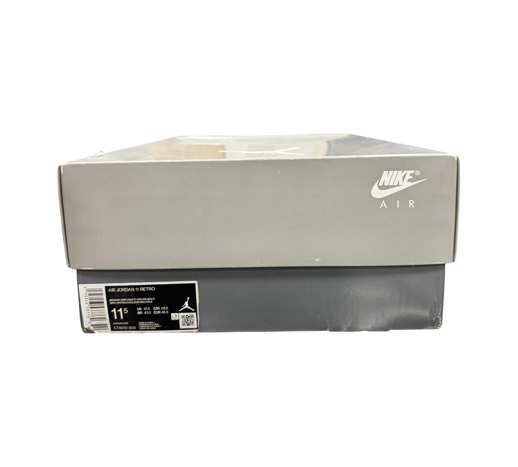 Genesis Boutique Jordan 11 Cool Grey sneaker box with Nike Air branding on a grey lid in a retail store display