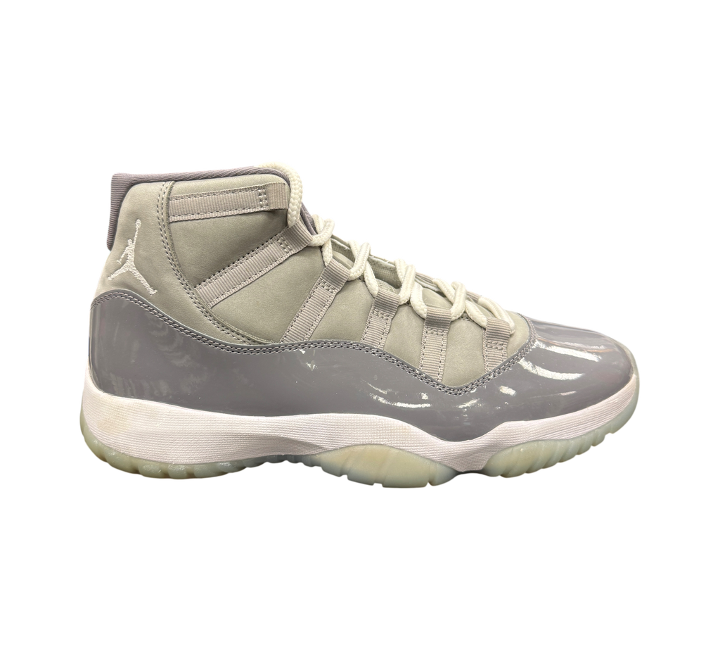 Genesis Boutique pre-owned Jordan 11 Cool Grey sneakers featuring grey suede, patent leather, and translucent soles.