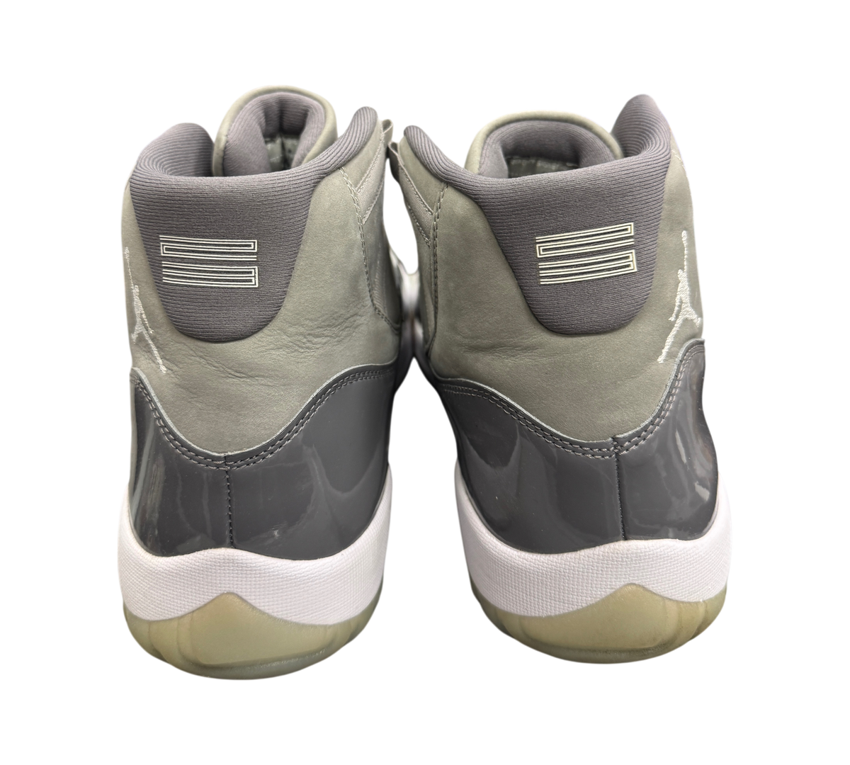 Genesis Boutique Jordan 11 Cool Grey sneakers showing the grey patent leather heel and white midsole from behind