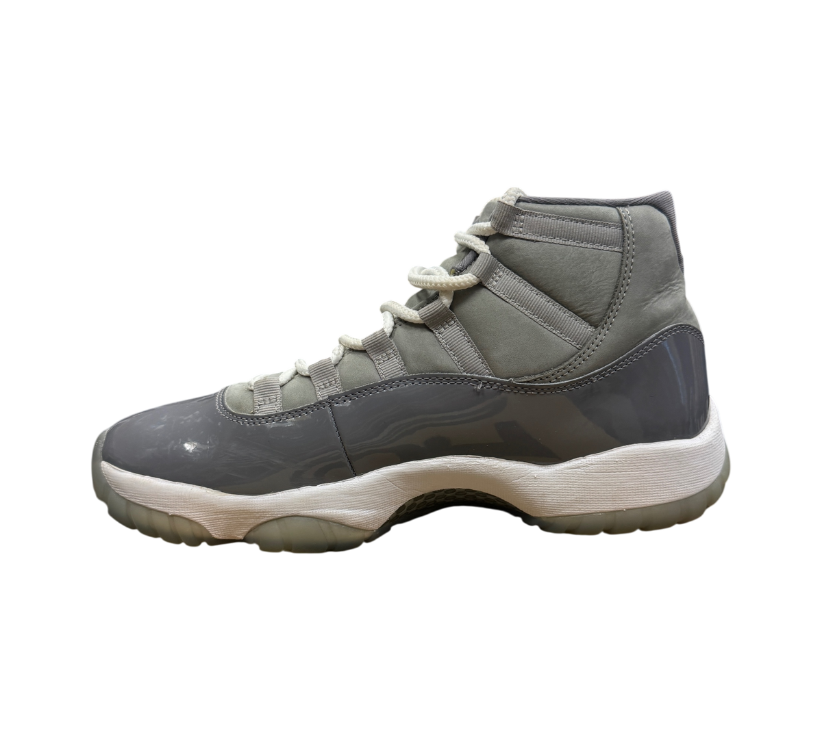 Genesis Boutique Jordan 11 Cool Grey sneakers in grey patent leather and nubuck with white laces and translucent sole
