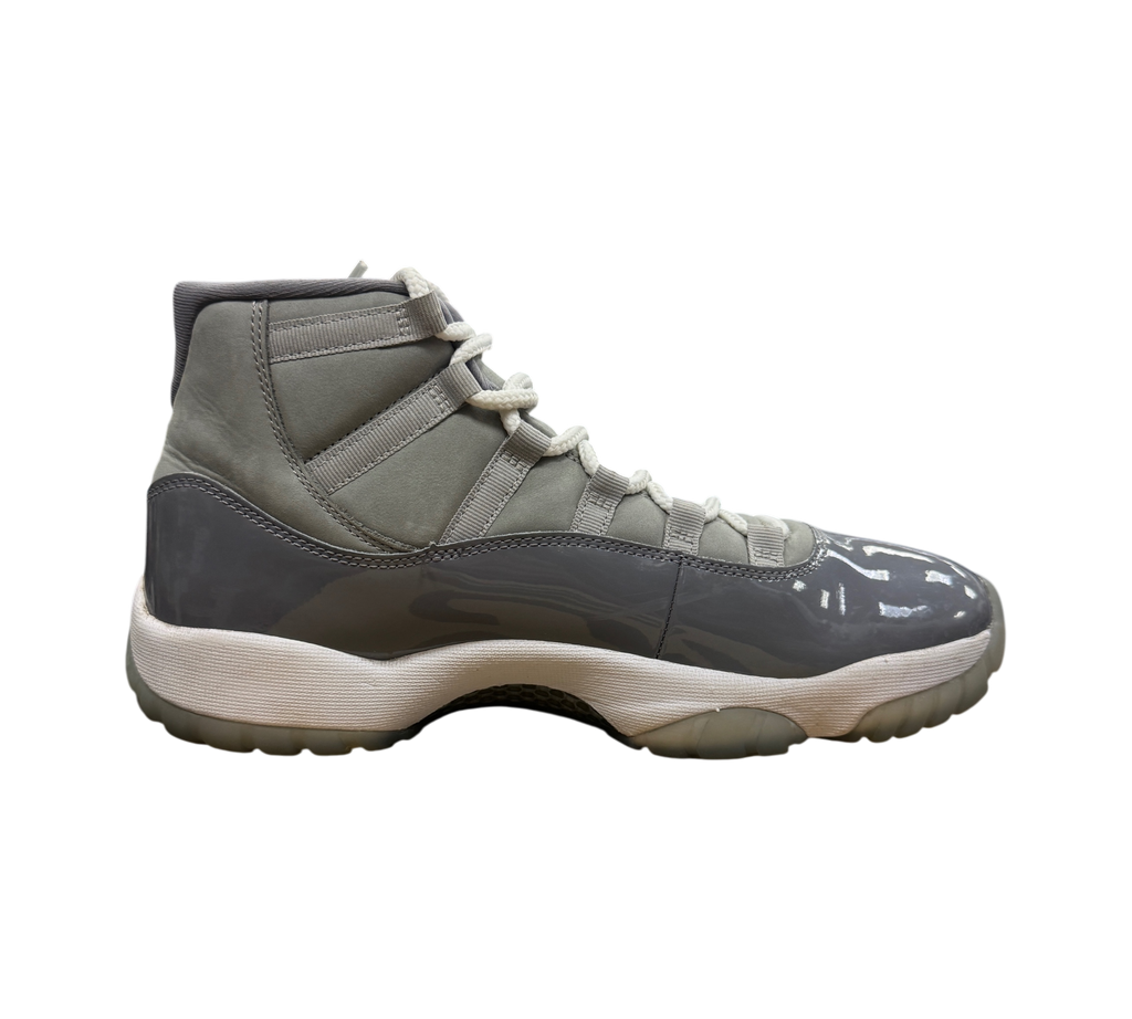 Genesis Boutique used Jordan 11 Cool Grey sneakers featuring a grey nubuck upper and glossy patent leather mudguard.
