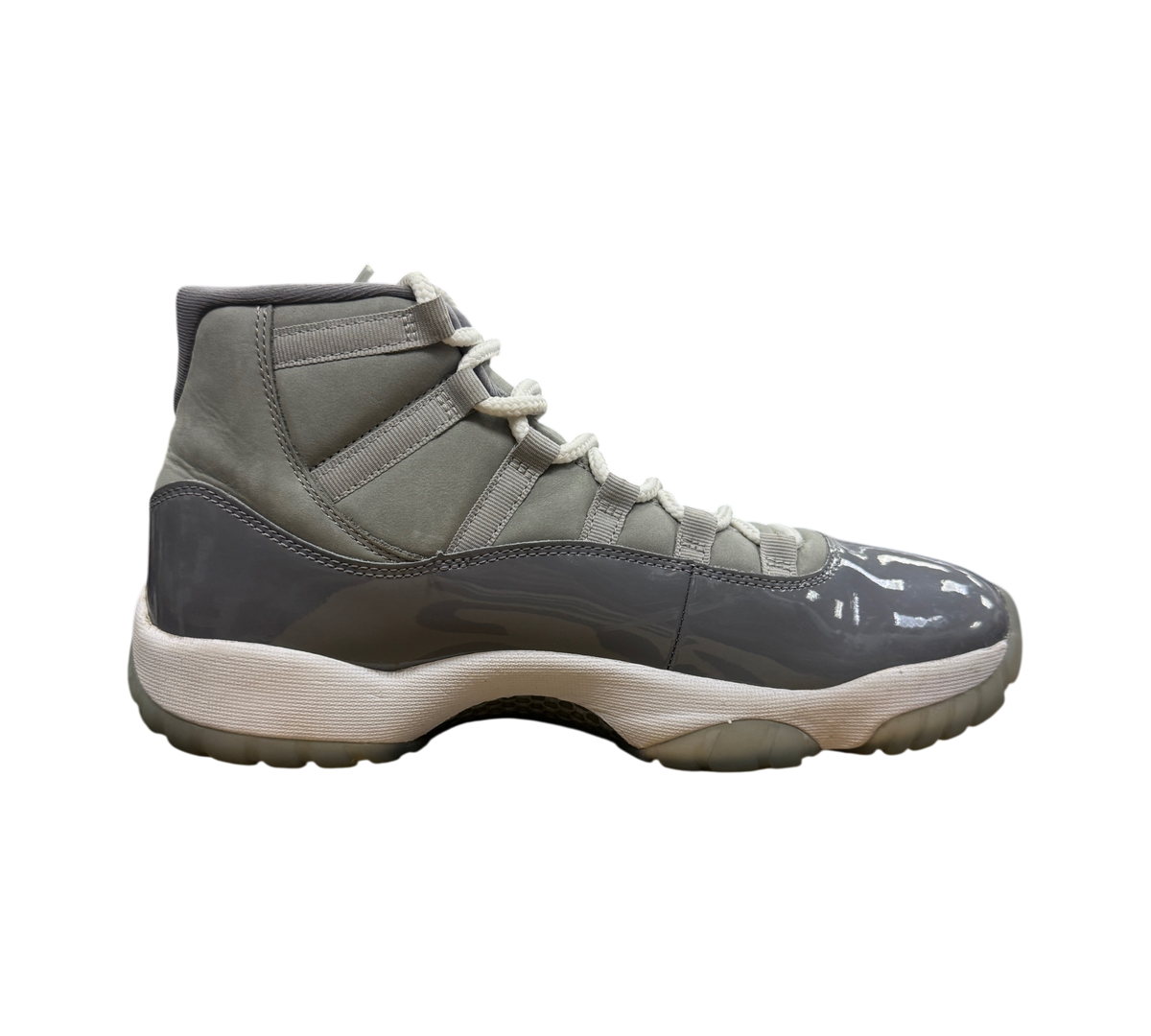 Genesis Boutique used Jordan 11 Cool Grey sneakers featuring a grey nubuck upper and glossy patent leather mudguard.