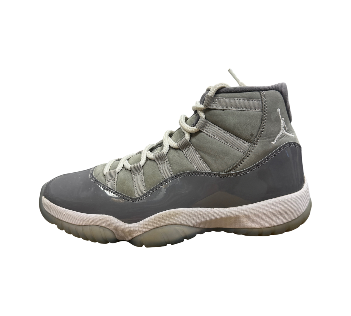 Genesis Boutique Jordan 11 Cool Grey sneakers featuring grey nubuck and patent leather with white laces and midsole